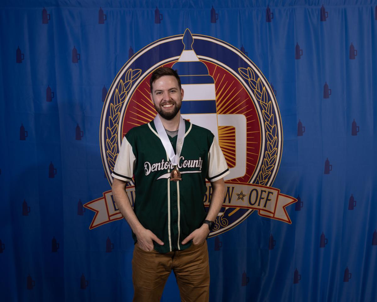 Josh Hayes modeling a medal at Bluebonnet 2025